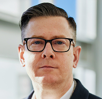 Alexander Hughes, CEO at a cryptocurrency trading company, headshot